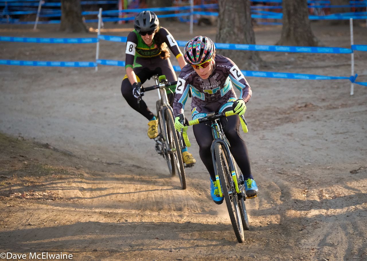Arley Kemmerer (Fearless Femme Racing) leading Julie Wright through a wooded section of the course
