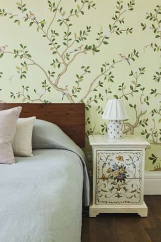 guest room with handpainted botanical wallpaper