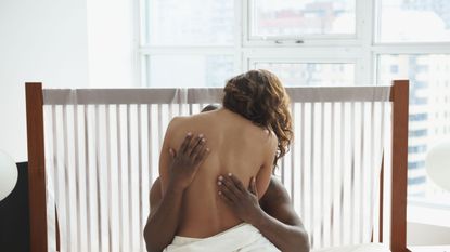 Woman and man hugging in bed