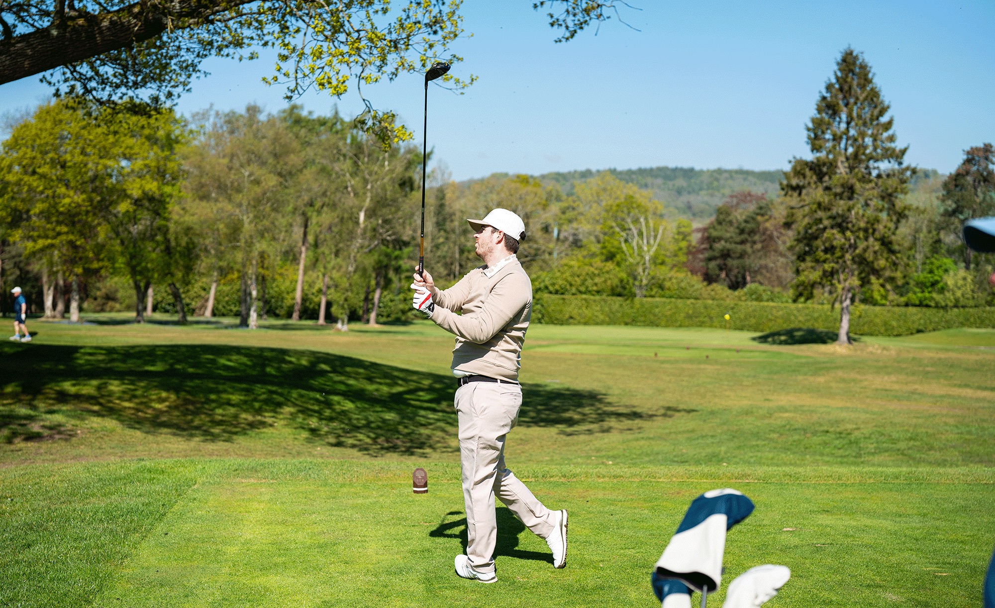 An amateur golfer hitting a driver off the tee