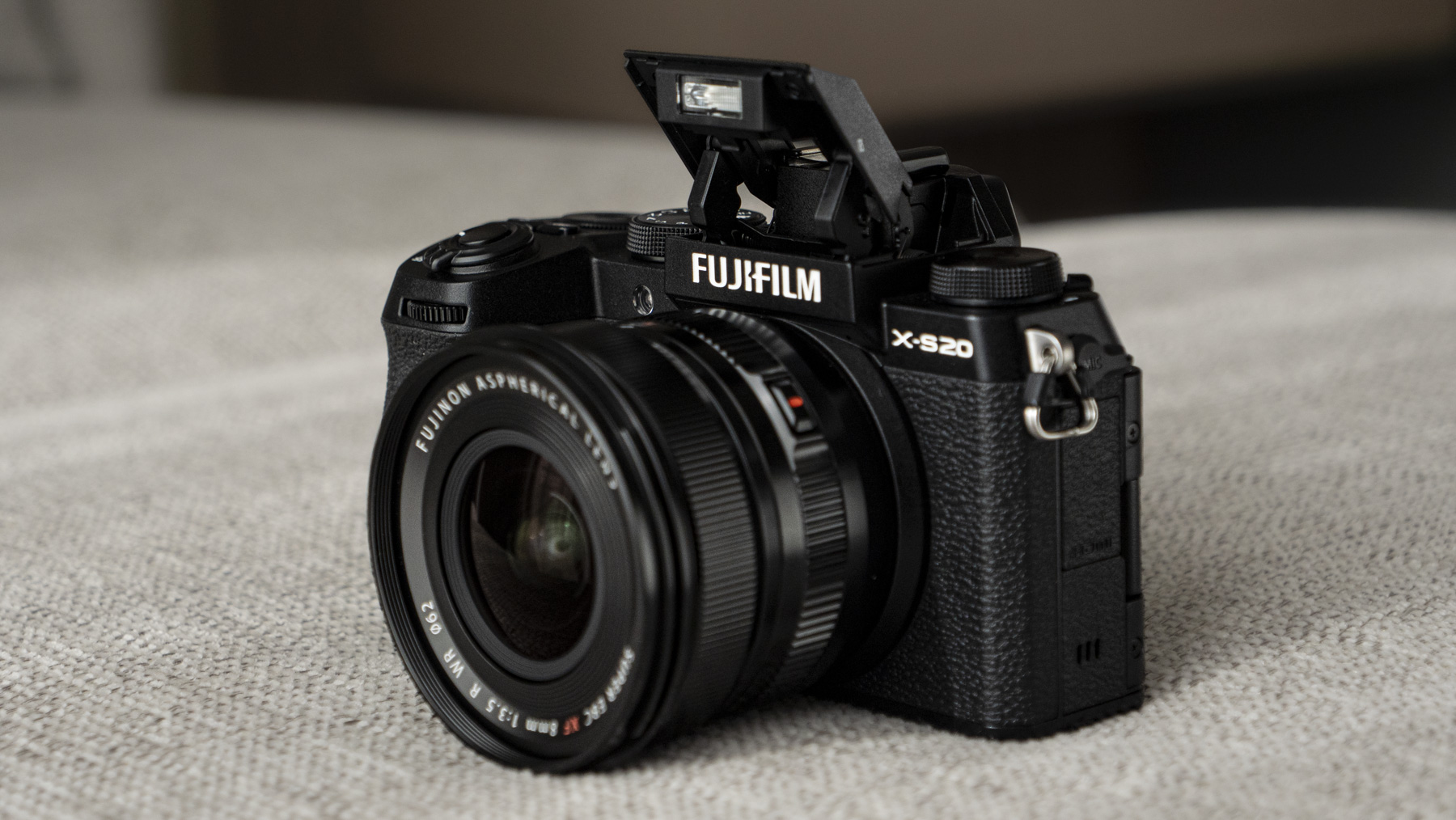 Fujifilm X-S20 camera front with built-in flash up