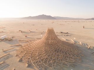 Galaxia, the temple for the 2018 Burning Man festival in Nevada’s Black Rock Desert, was formed of 20 timber trusses that converged in a central spiral and set on fire at the festival’s end