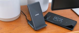 Anker 313 Wireless Charging Stand on a wooden surface