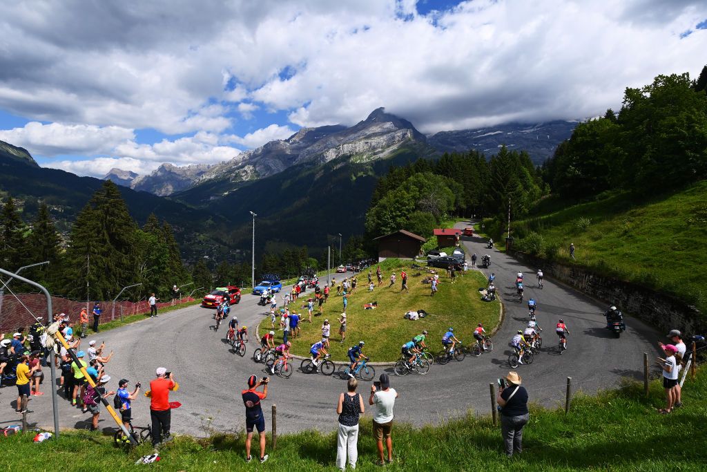 CHTEL LES PORTES DU SOLEIL FRANCE JULY 10 A general view of the peloton passing through the Col de la Croix 1769m while fans cheer during the 109th Tour de France 2022 Stage 9 a 1929km stage from Aigle to Chtel les portes du Soleil 1299m TDF2022 WorldTour on July 10 2022 in Chtel les portes du Soleil France Photo by Tim de WaeleGetty Images