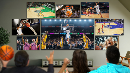 Eight Samsung TVs mounted to the wall showing different basketball games 