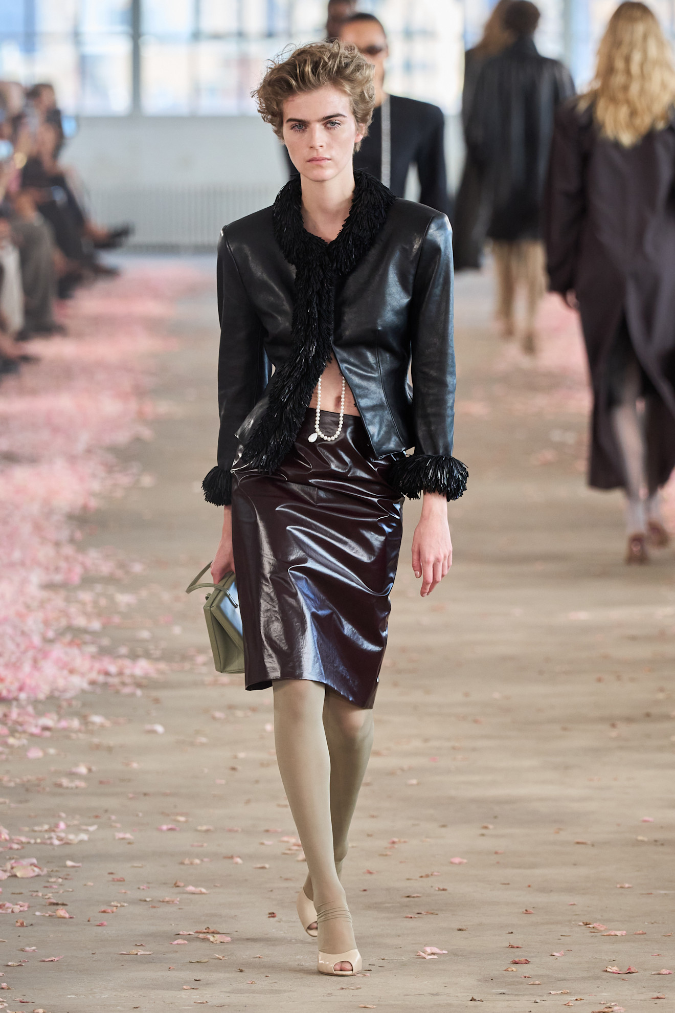 A model wore Hailey Bieber's black leather jacket on the Magda Butrym Spring 2027 runway