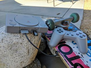PlayStation Classic and skateboard