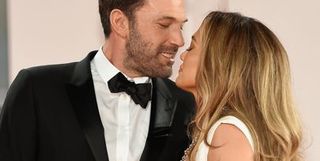 Ben Affleck and Jennifer Lopez stand intimately close on the red carpet