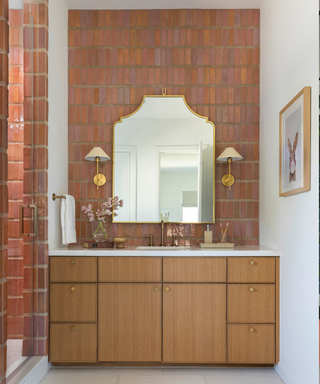 A bathroom decorated with pink Zellige tile with wide grout