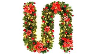 Pre-lit faux evergreen garland with poinsettias and baubles