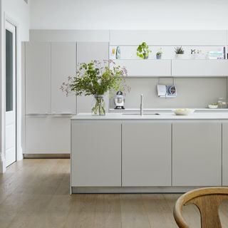 Grey kitchen cabinets with white countertop