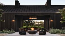 view of a patio, black chairs and a fire pit in napa valley guest house by Nicole Hollis