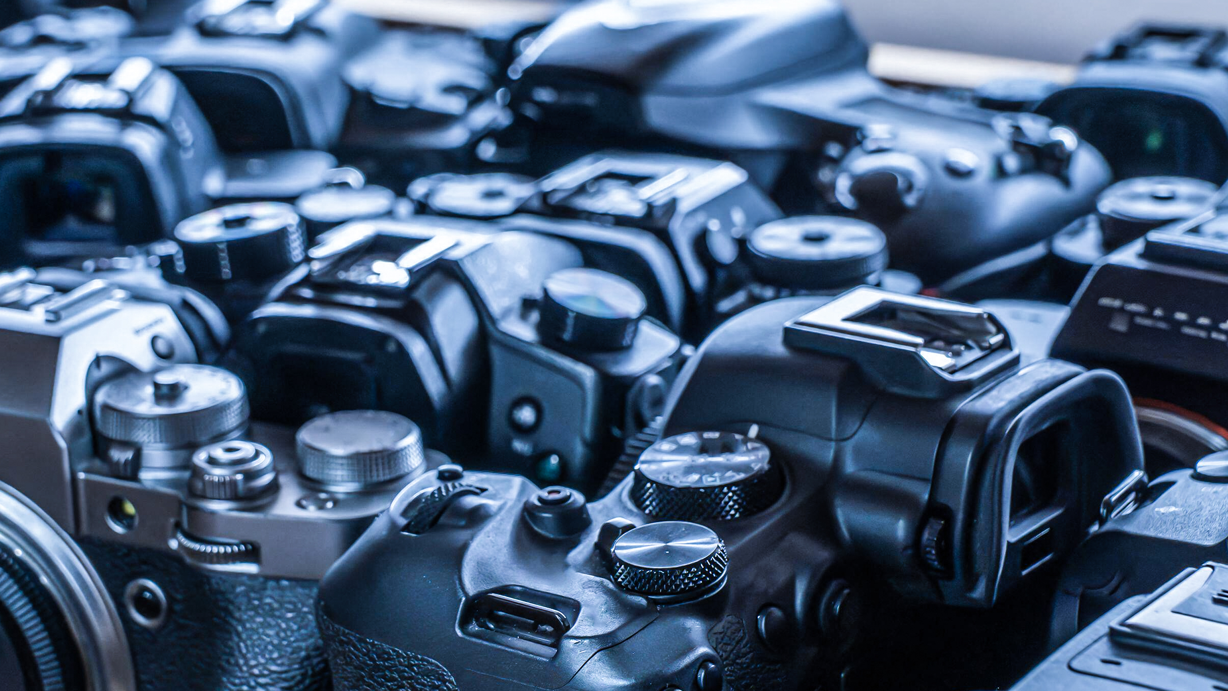 Group of secondhand cameras in a drawer in camera store