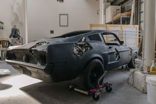 sculpture of a black Ford Mustang