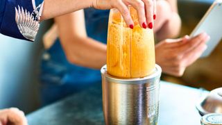 Mango and banana smoothie in blender