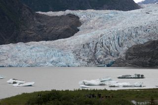 Mendenhall Glacier in Juneau, Alaska, with icebergs in front of it