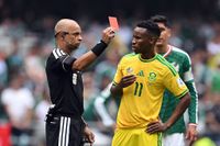 Brazilian referee Wilton Sampaio shows a red card to South Africa's midfielder #11 Themba Zwane during the 2026 World Cup Group A football match between Mexico and South Africa