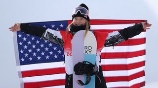  Gold medallist Chloe Kim of Team United States celebrates during the Women's Snowboard Halfpipe Final flower ceremony on Day 6 of the Beijing 2022 Winter Olympics at Genting Snow Park on February 10, 2022 in Zhangjiakou, China.