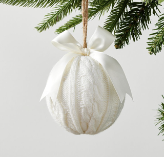White knit Christmas tree ornament with decorative bow from Pottery Barn.