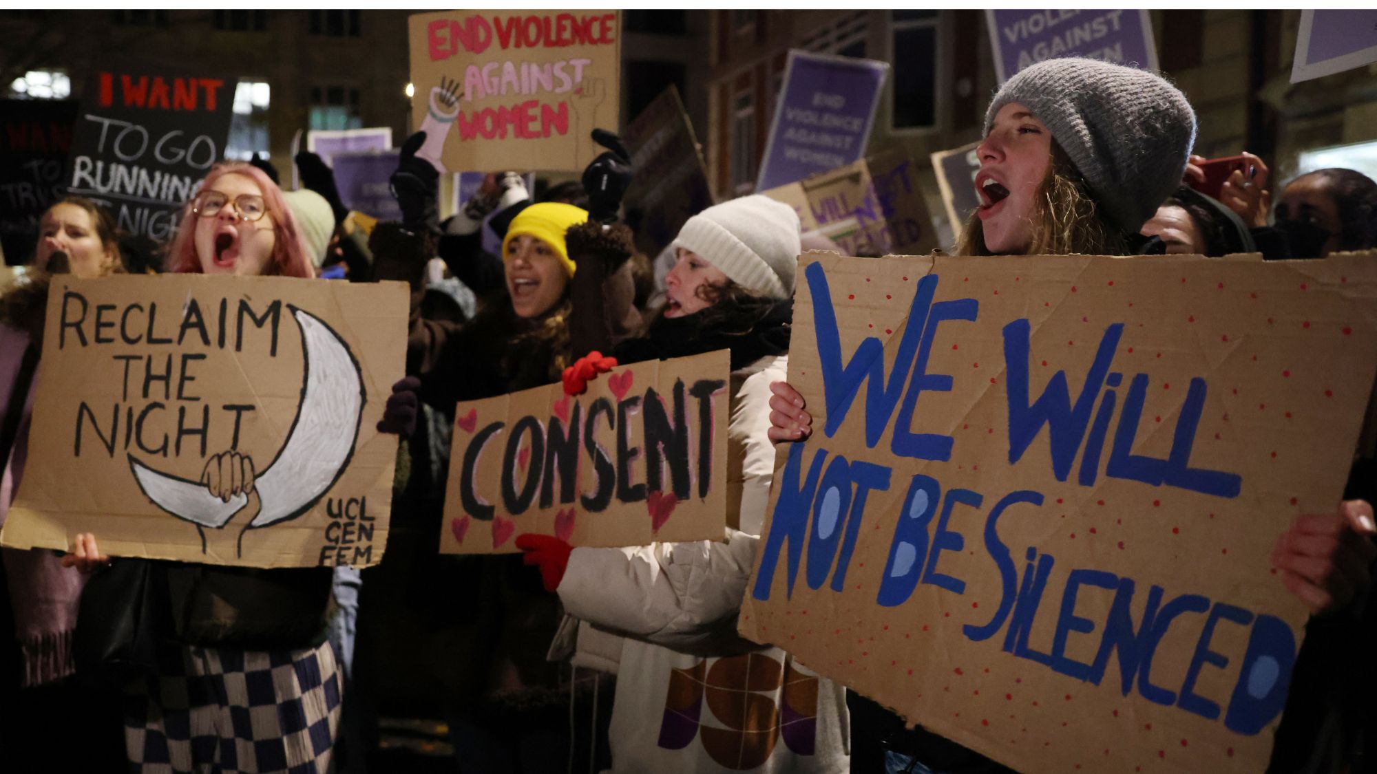 Women carry placards during the London Reclaim the Night! Women in protest at rape and all forms of male violence against women. 