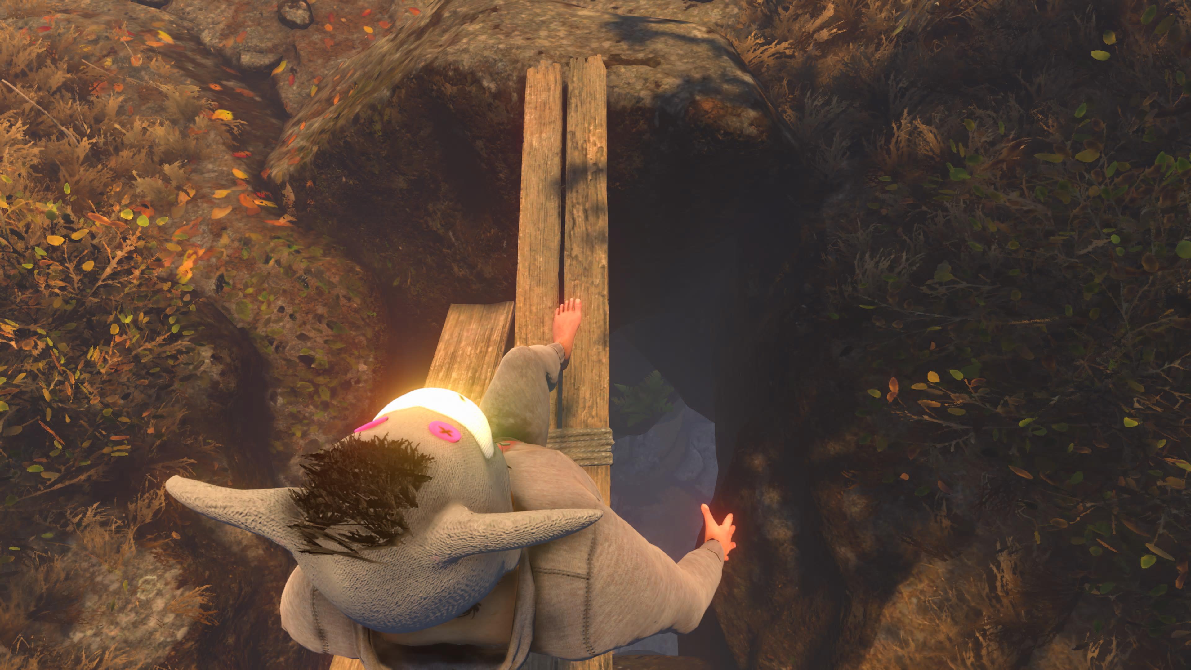 Looking straight down on Nate in Baby Steps as he carefully moves his feet across planks