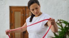 Woman holding resistance band
