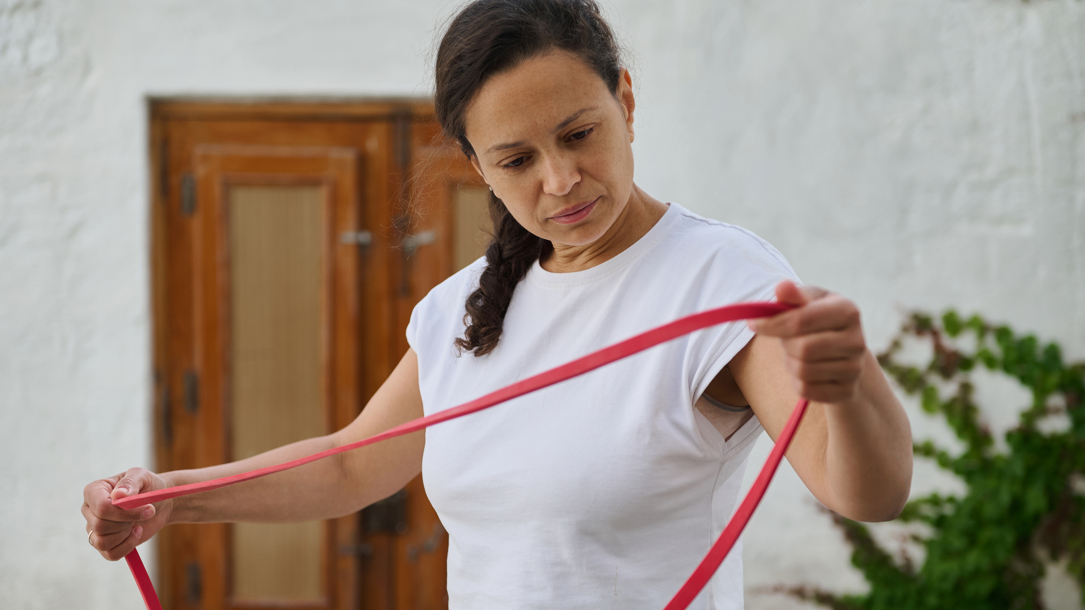 Woman holding resistance band