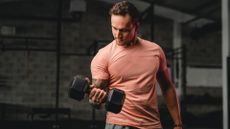 A man performing dumbbell bicep curls