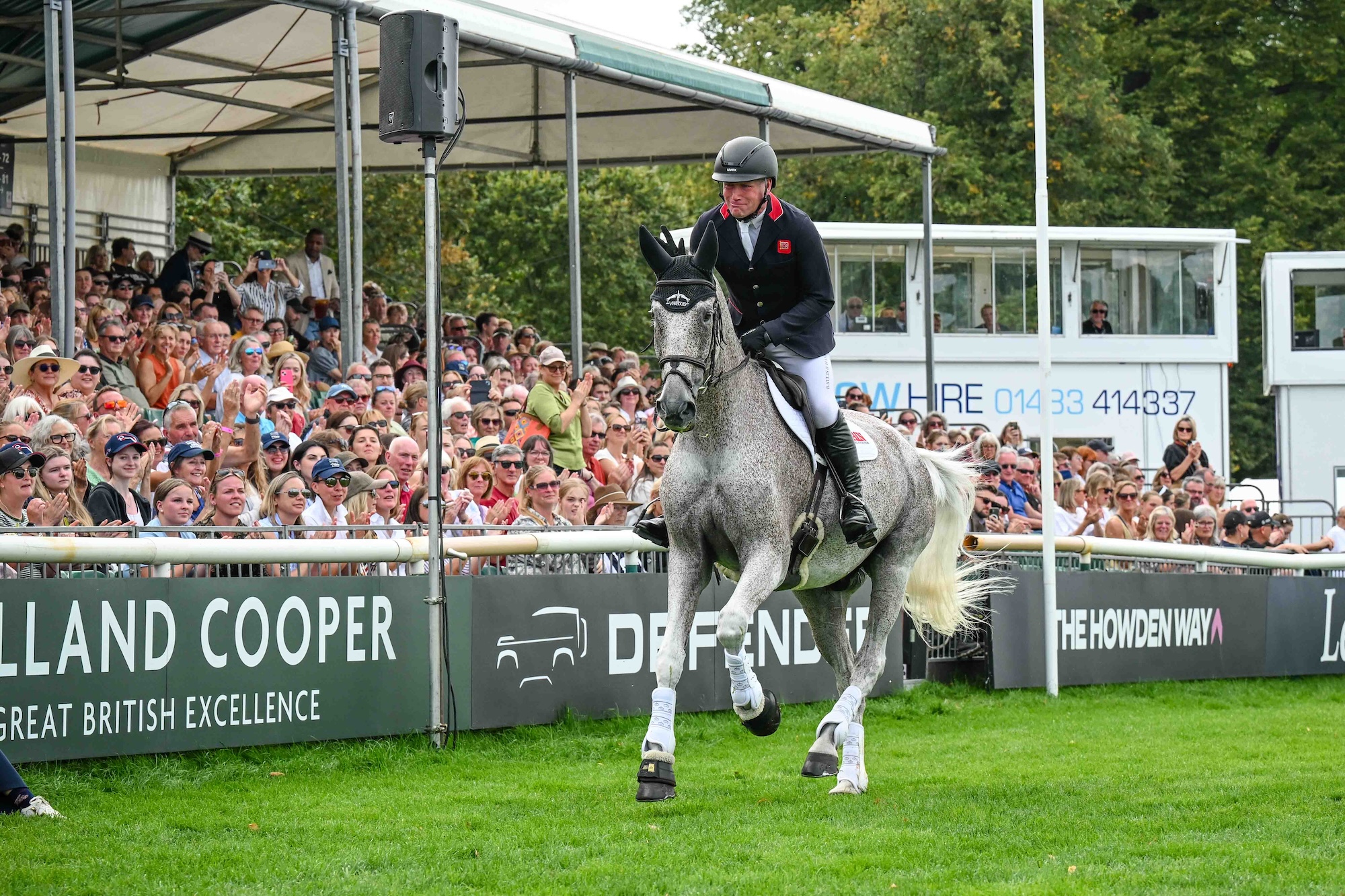 Ballaghmor Class canters past a cheering crowd with Oliver Townend as he retires at Burghley