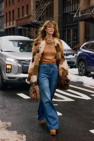 woman in faux-fur coat