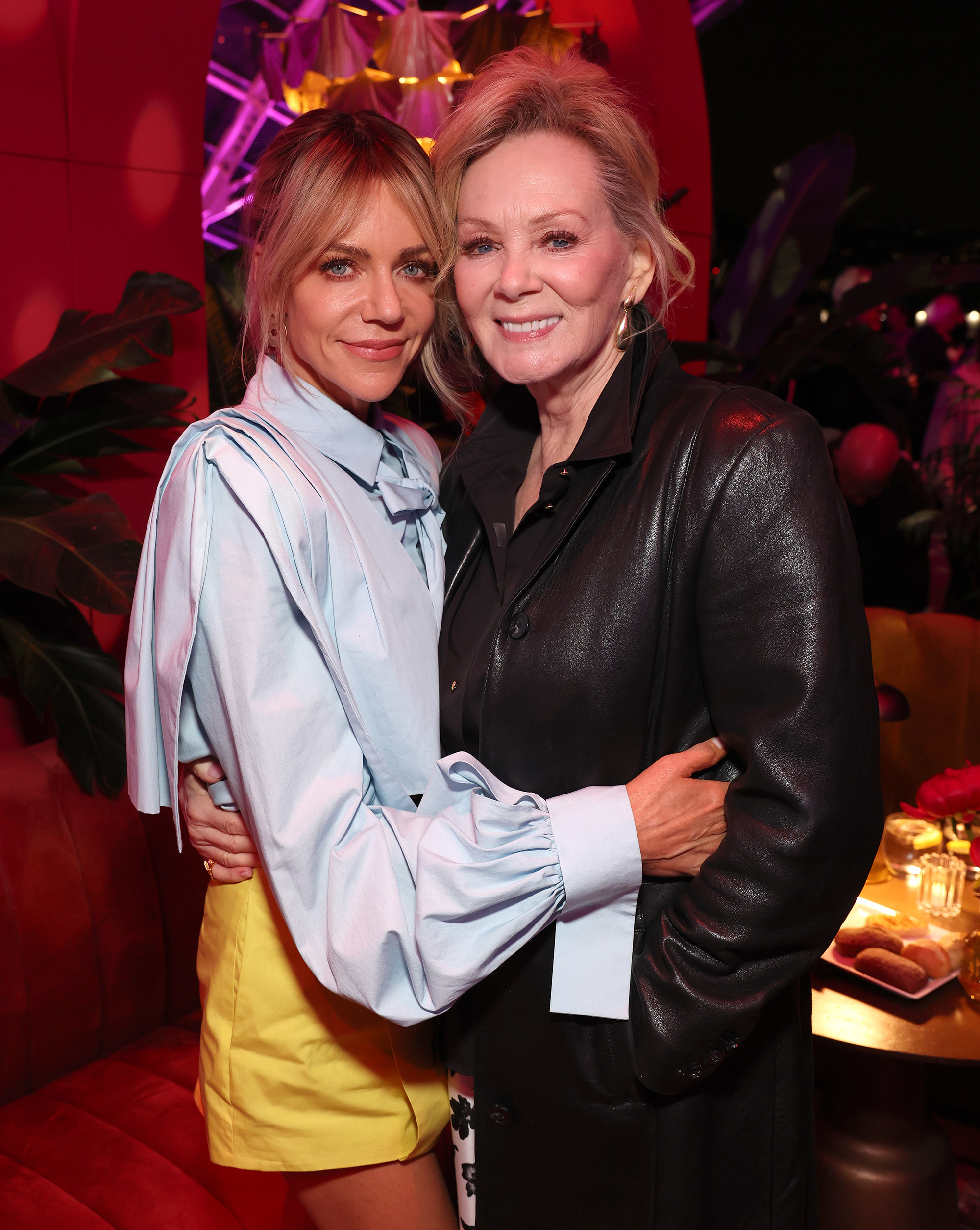 Kaitlin Olson and Jean Smart pose together at one of Hacks' final events in 2026. Olson has on shorts and a long sleeve blouse. Smart has on a black jacket and pants.