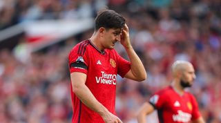 Manchester Unite defender Harry Maguire looks dejected