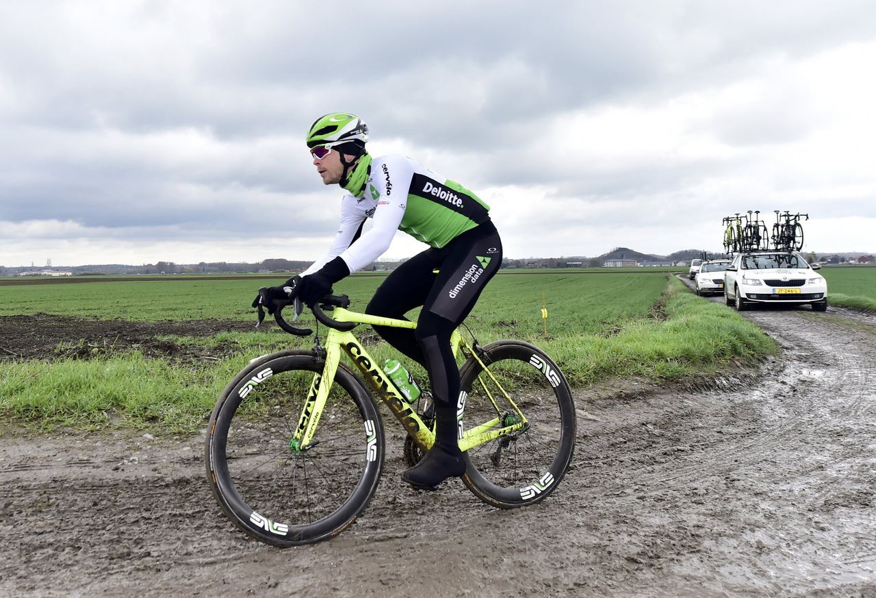 Julien Vermote (Dimension Data) tests the muddy pav&eacute; of Paris-Roubaix
