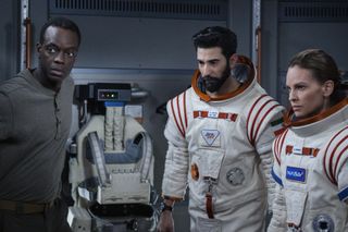 Emma (Hilary Swank), Ram (Ray Panthaki), and Kwesi (Ato Essandoh) ponder the dangers of their mission.