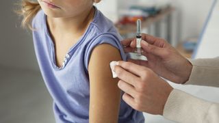 child receiving vaccine