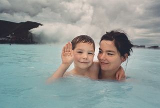Björk and son in thermal pool