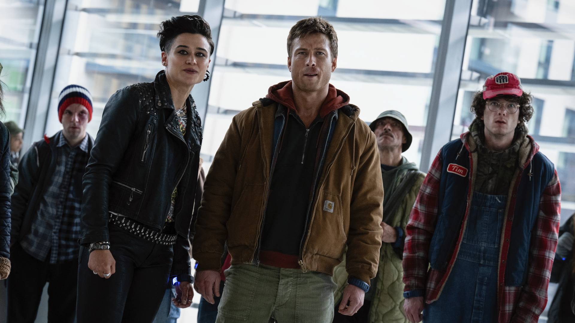 Glen Powell, Katy O&#039;Brian, and Martin Herlihy in The Running Man