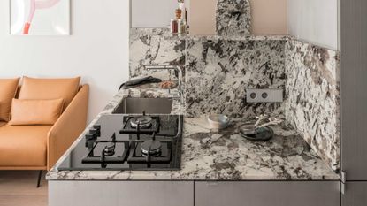 a kitchen with a bold granite countertop