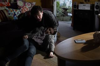 Marlon panics as he finds April slumped on the floor at Smithy