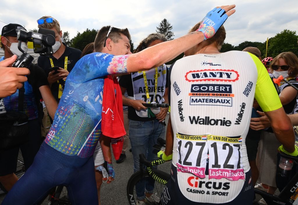 IsraelPremier Tech teams Australian rider Simon Clarke L celebrates with IntermarcheWantyGobert Materiaux teams Dutch rider Taco Van Der Hoorn R after winning the 5th stage of the 109th edition of the Tour de France cycling race 1537 km between Lille and Arenberg Porte du Hainaut in northern France on July 6 2022 Photo by Tim De Waele POOL AFP Photo by TIM DE WAELEPOOLAFP via Getty Images