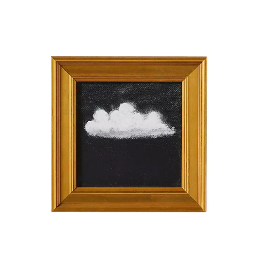 A minimalist piece of wall art in gold frame