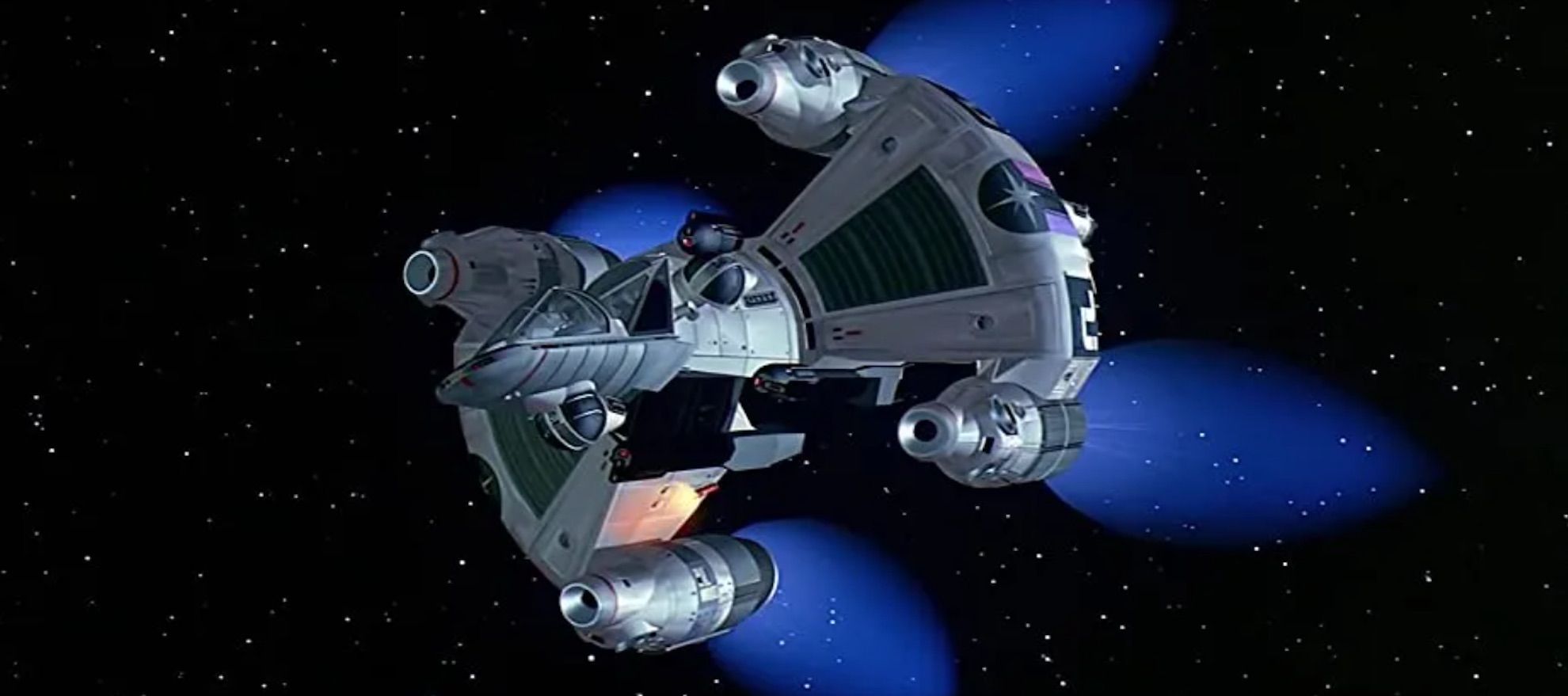 a CGI spaceship with thrusters burning blue