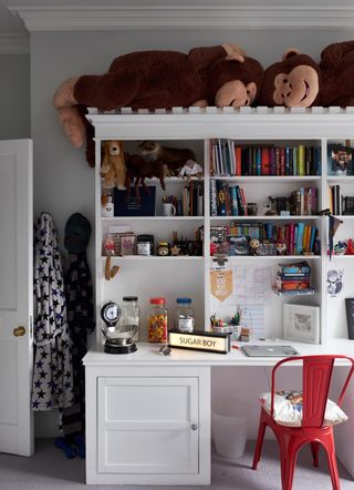 boys bedroom with book shelves and desk