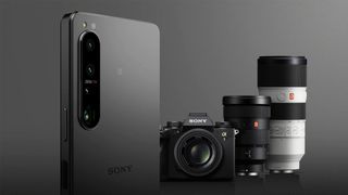 The Sony Xperia 1 IV phone next to some cameras and lenses