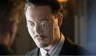 Boardwalk Empire Jack Huston looks dour with his face mask on