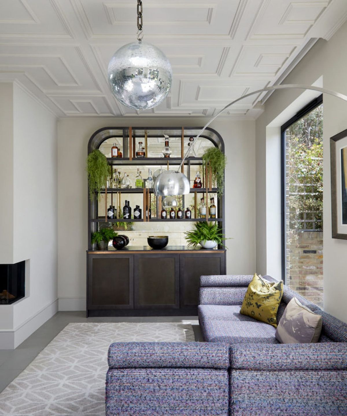 A kitchen extension with a Velux window and glitter ball hanging from the ceiling