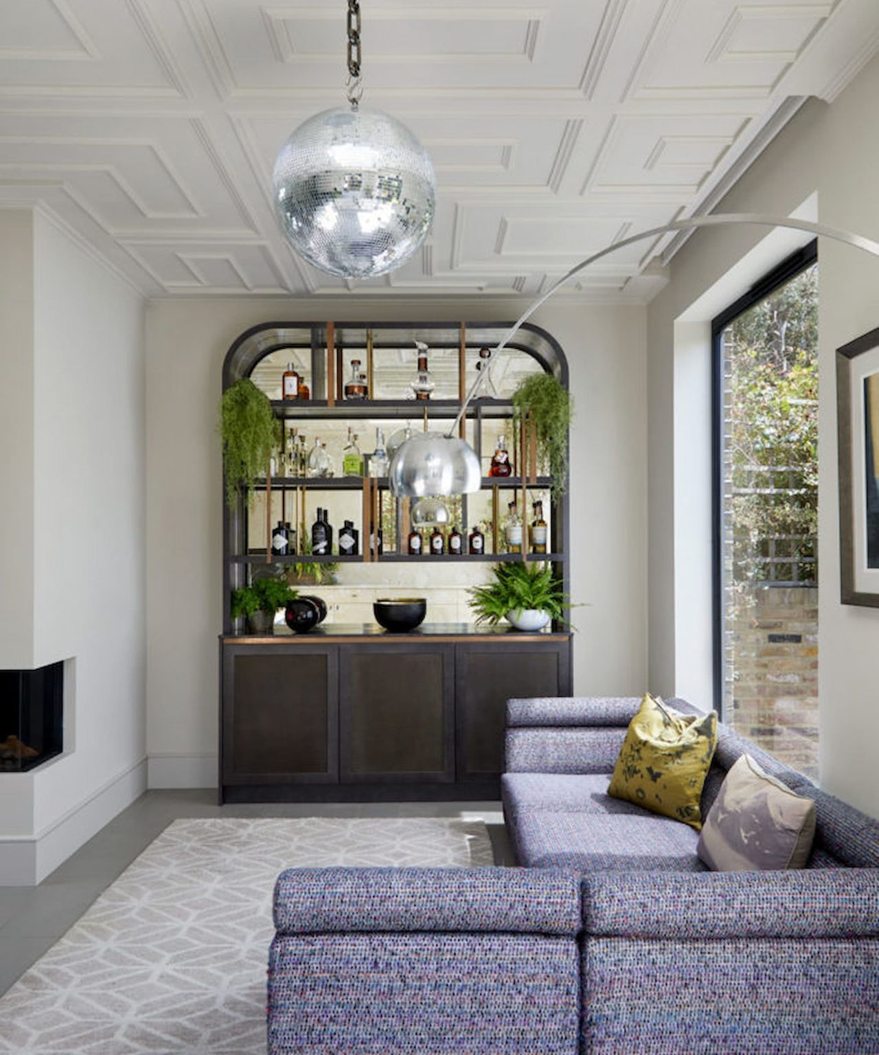 A kitchen extension with a Velux window and glitter ball hanging from the ceiling