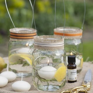 citronella candles in jars and scissors