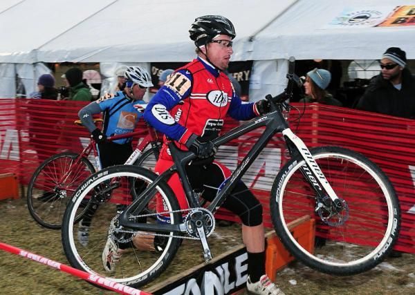 Tim Cannard (Ibis) racing over the barriers.