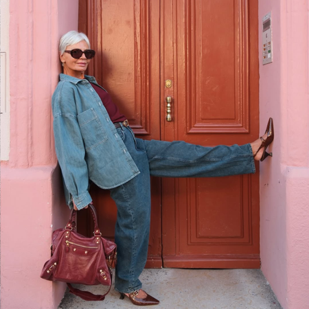 @greceghanem wears jeans and denim chore jacket